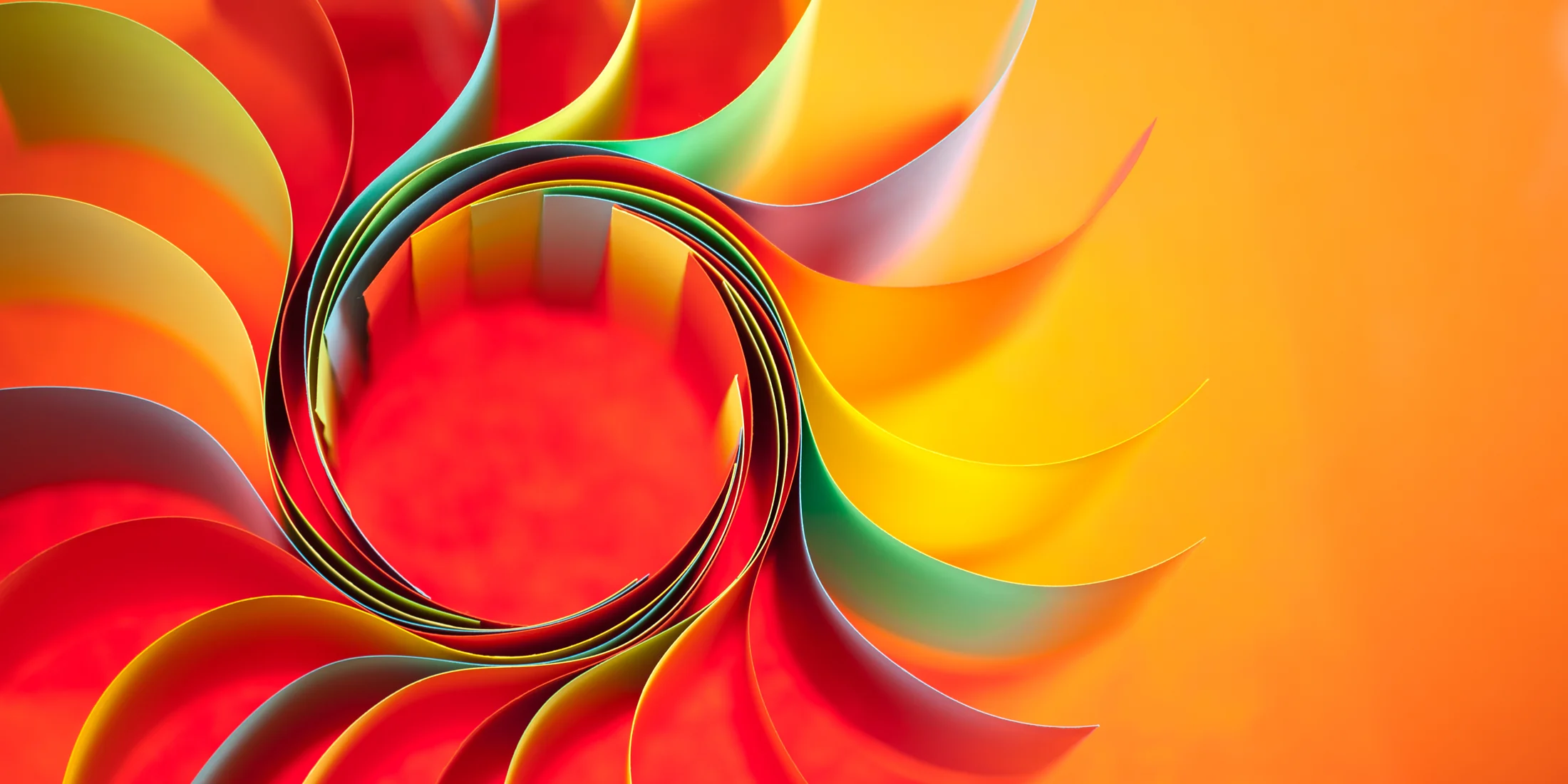 Swirling layers of vividly coloured paper forming an abstract pattern Swirling layers of vividly coloured paper forming an abstract pattern