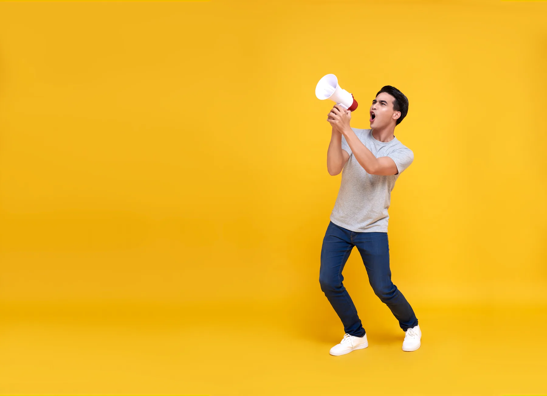 Young Man Making Announcement with Megaphone