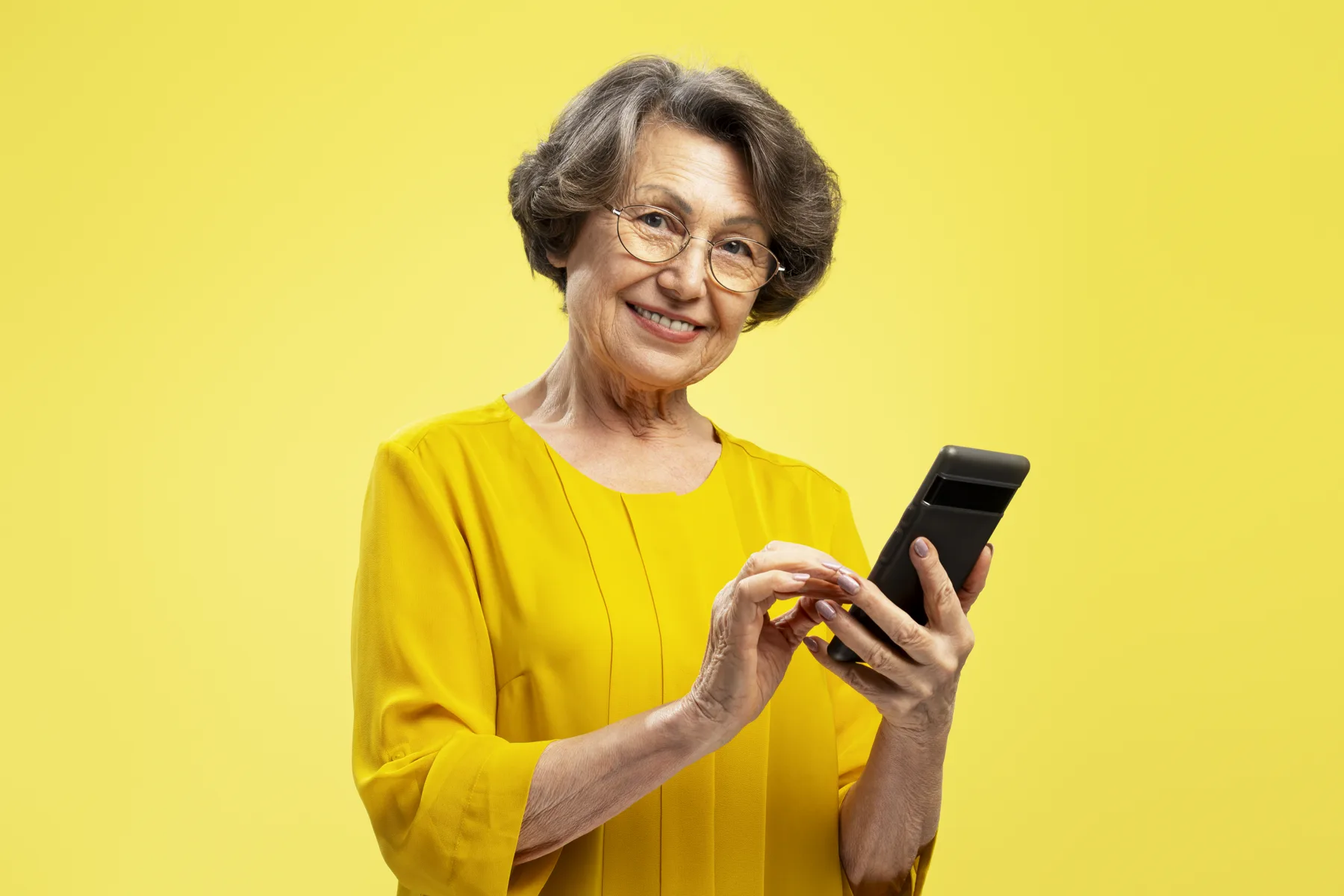 Smiling Senior Woman Using Mobile Phone