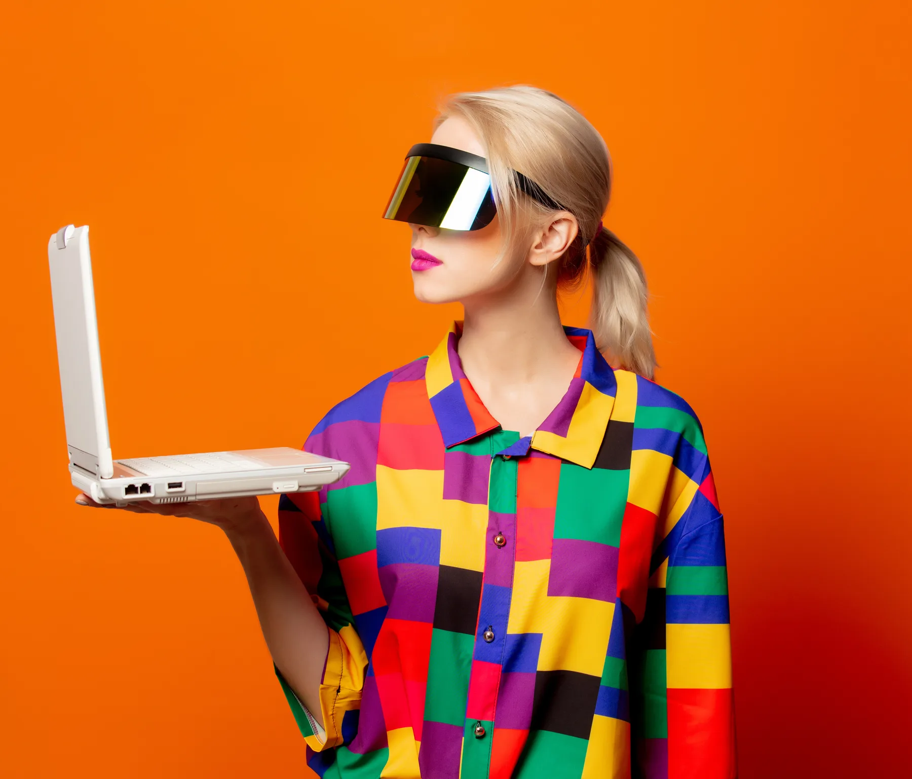 Woman in Retro Shirt with Laptop and Visor Woman in Retro Shirt with Laptop and Visor
