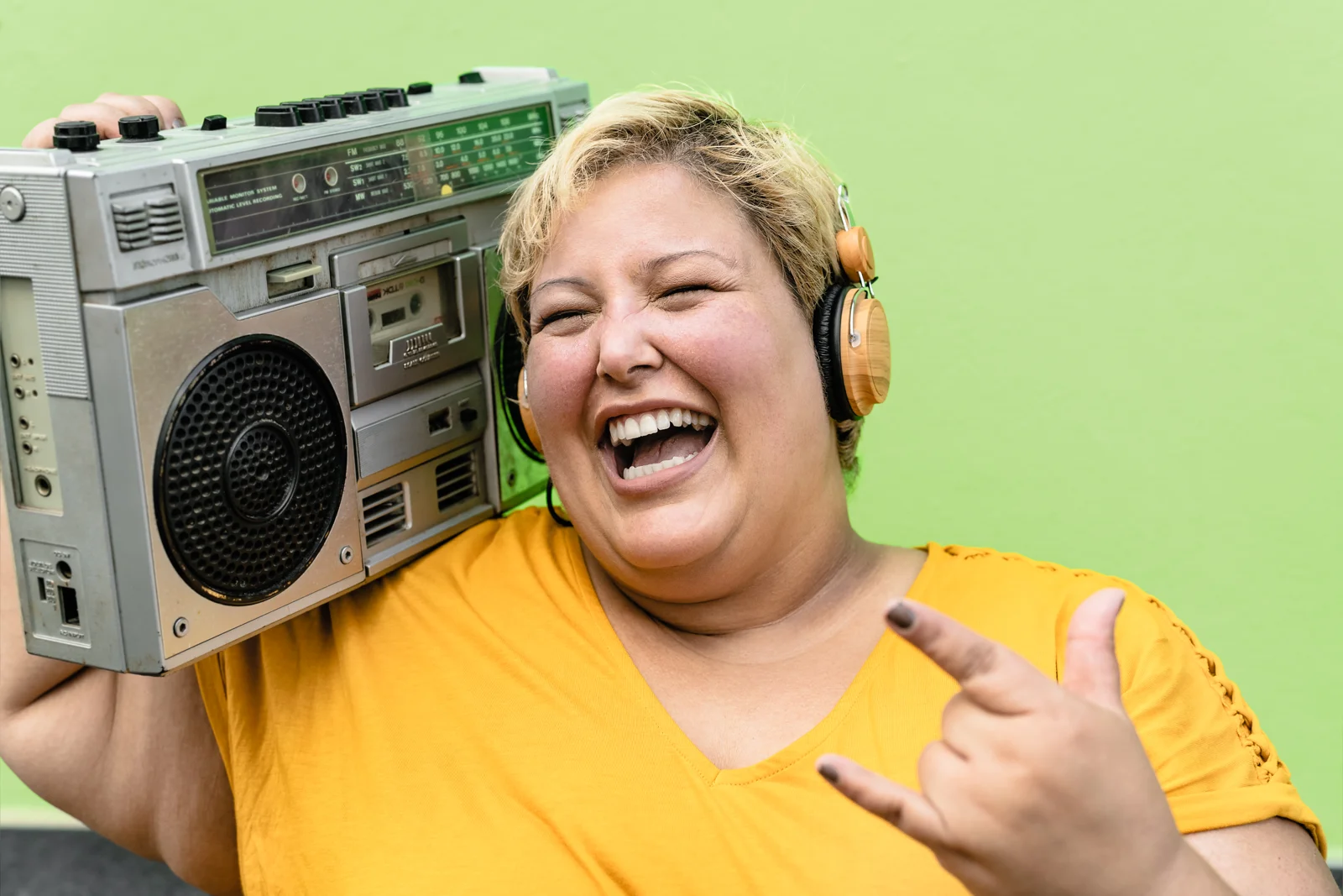 Woman enjoying music with a boombox